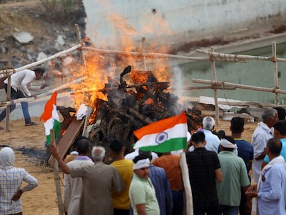 People attend the cremation of IAF (Indian Air Force) soldier Surendra Kumar who died during an attack on Udhampur, on the day of his funeral in Mahradasi village, Jhunjhunu in Rajasthan, India, May 11, 2025. REUTERS/Anushree Fadnavis